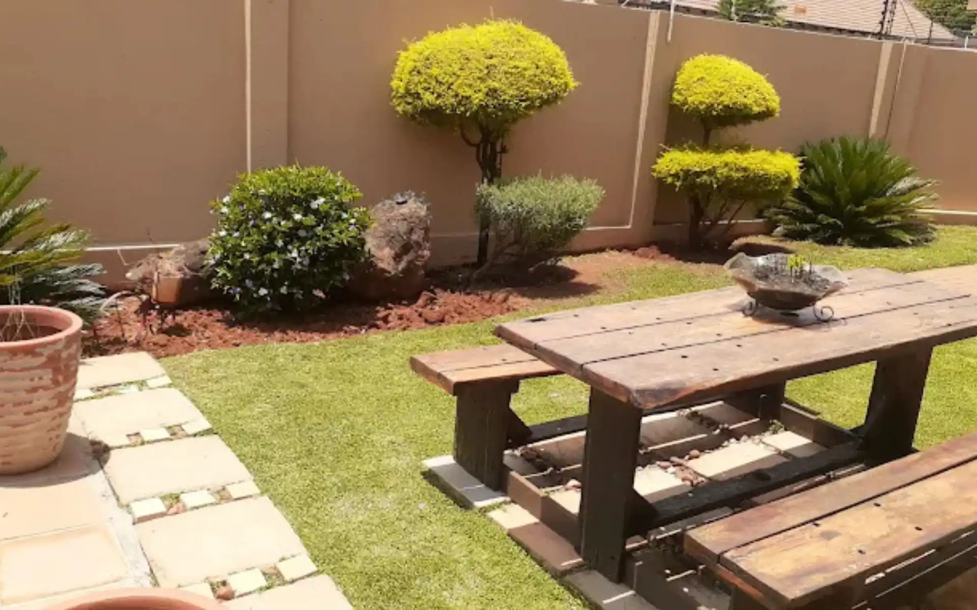 Beautifully landscaped garden with healthy lawn and mature planting in Cape Town